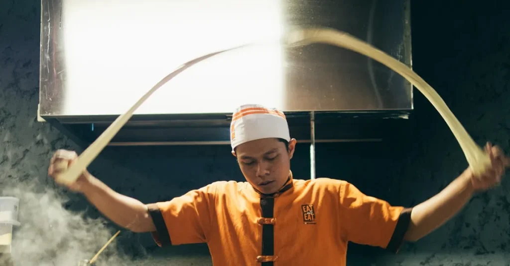 Man preparing noodles